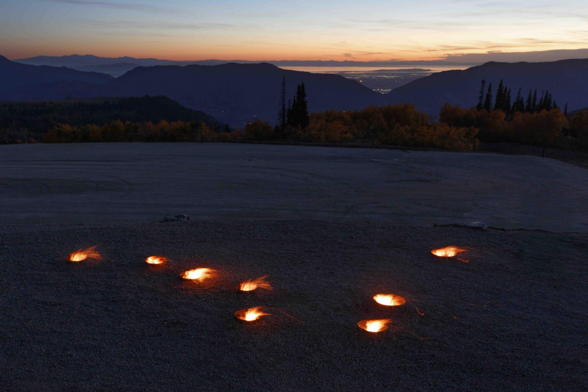 fire pits in the outline of a star constellation