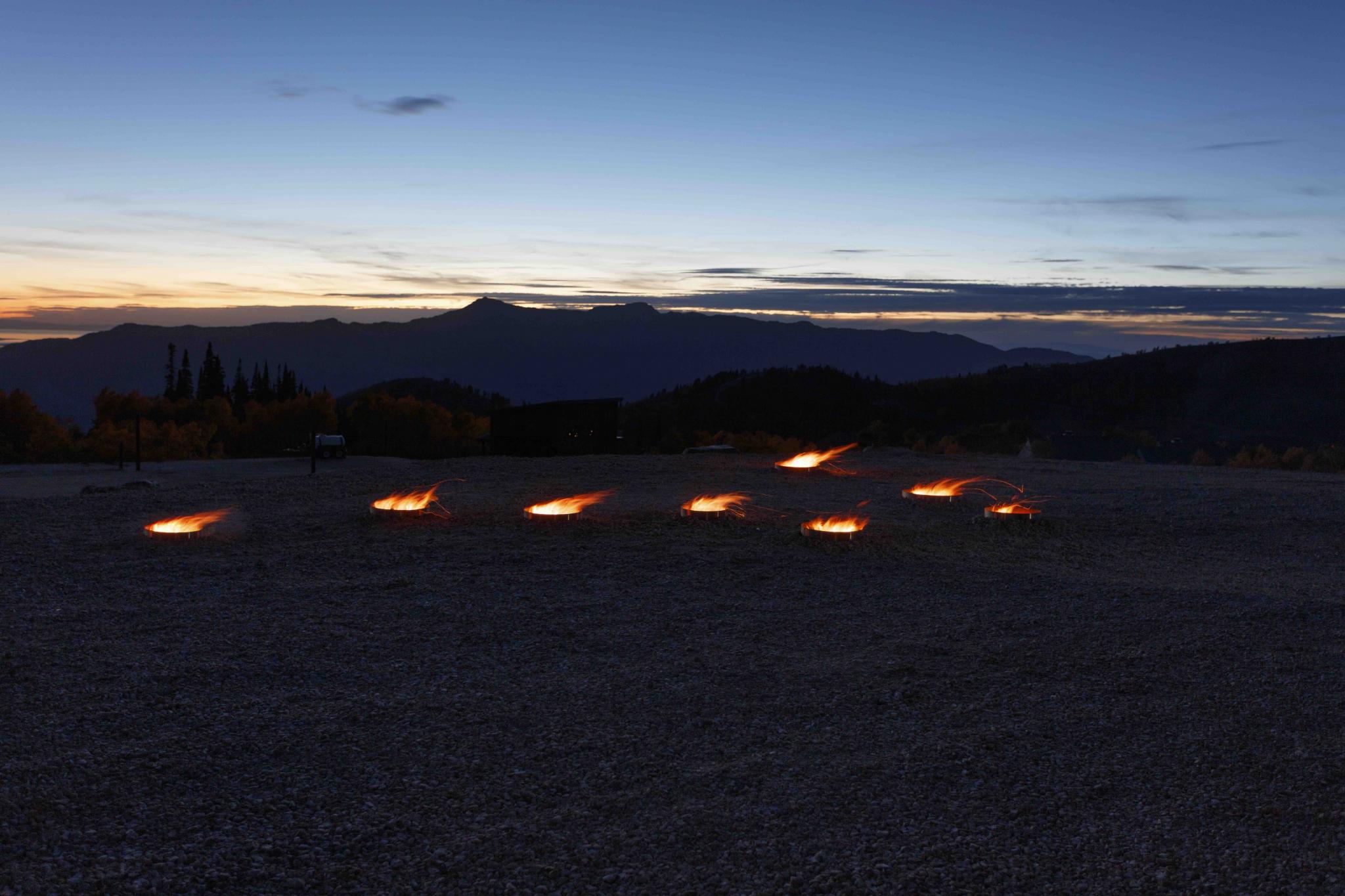 fire pits in the outline of a star constellation