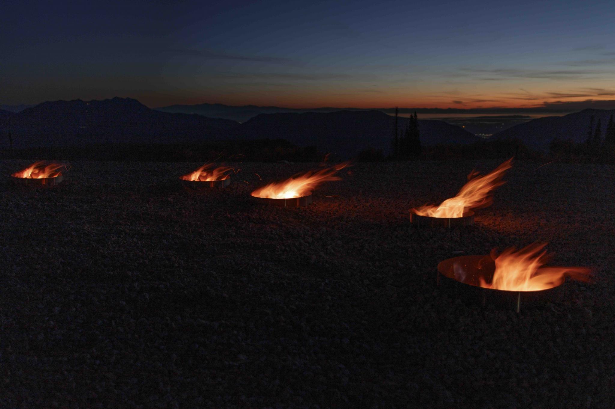 fire pits in the outline of a star constellation