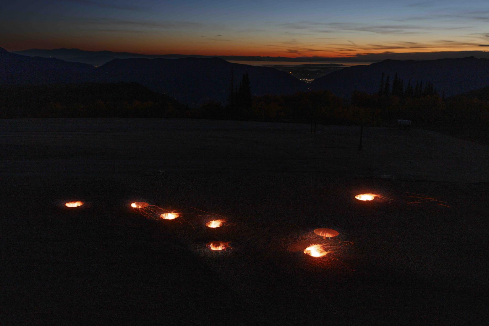 fire pits in the outline of a star constellation