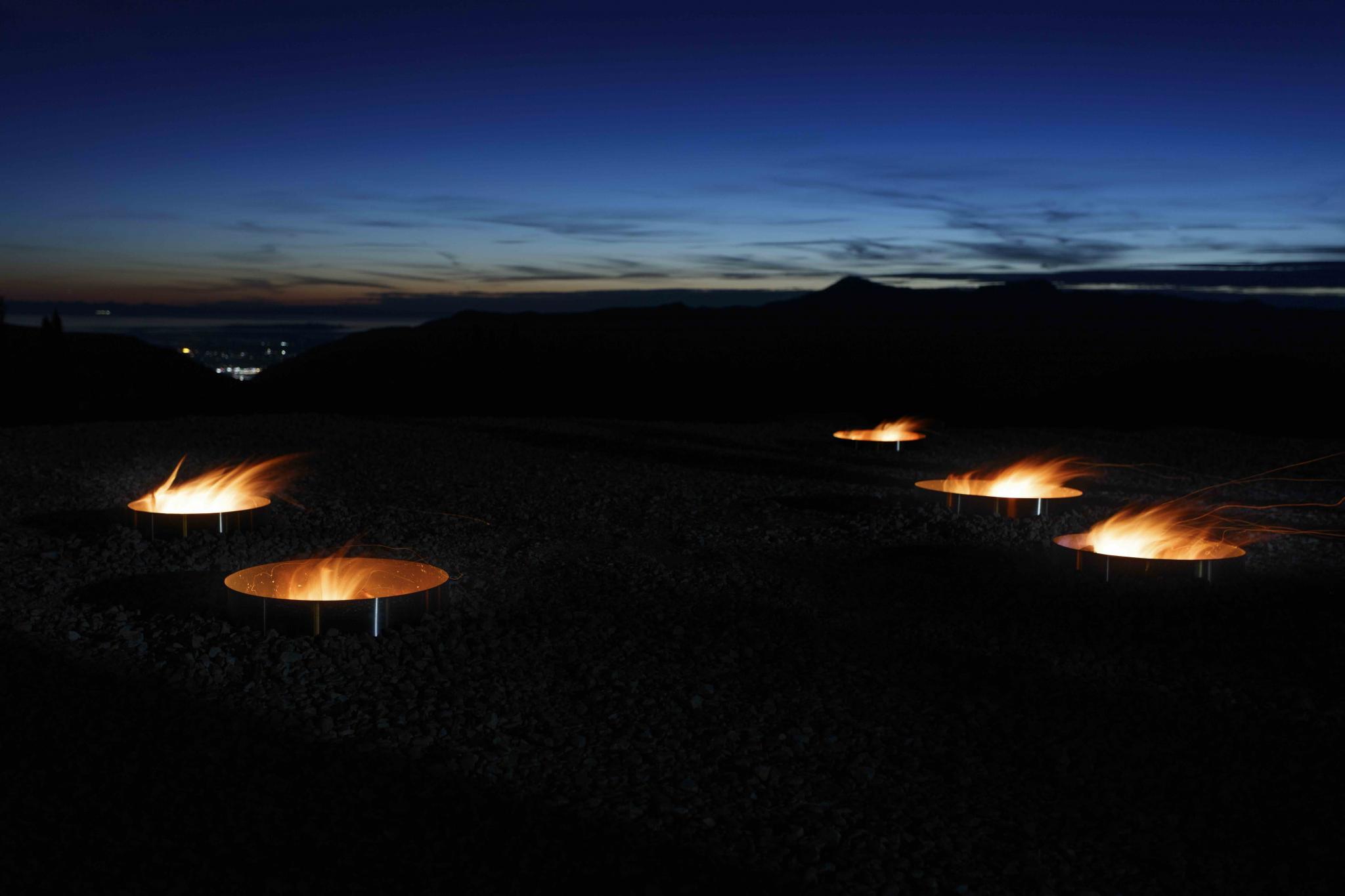 fire pits in the outline of a star constellation