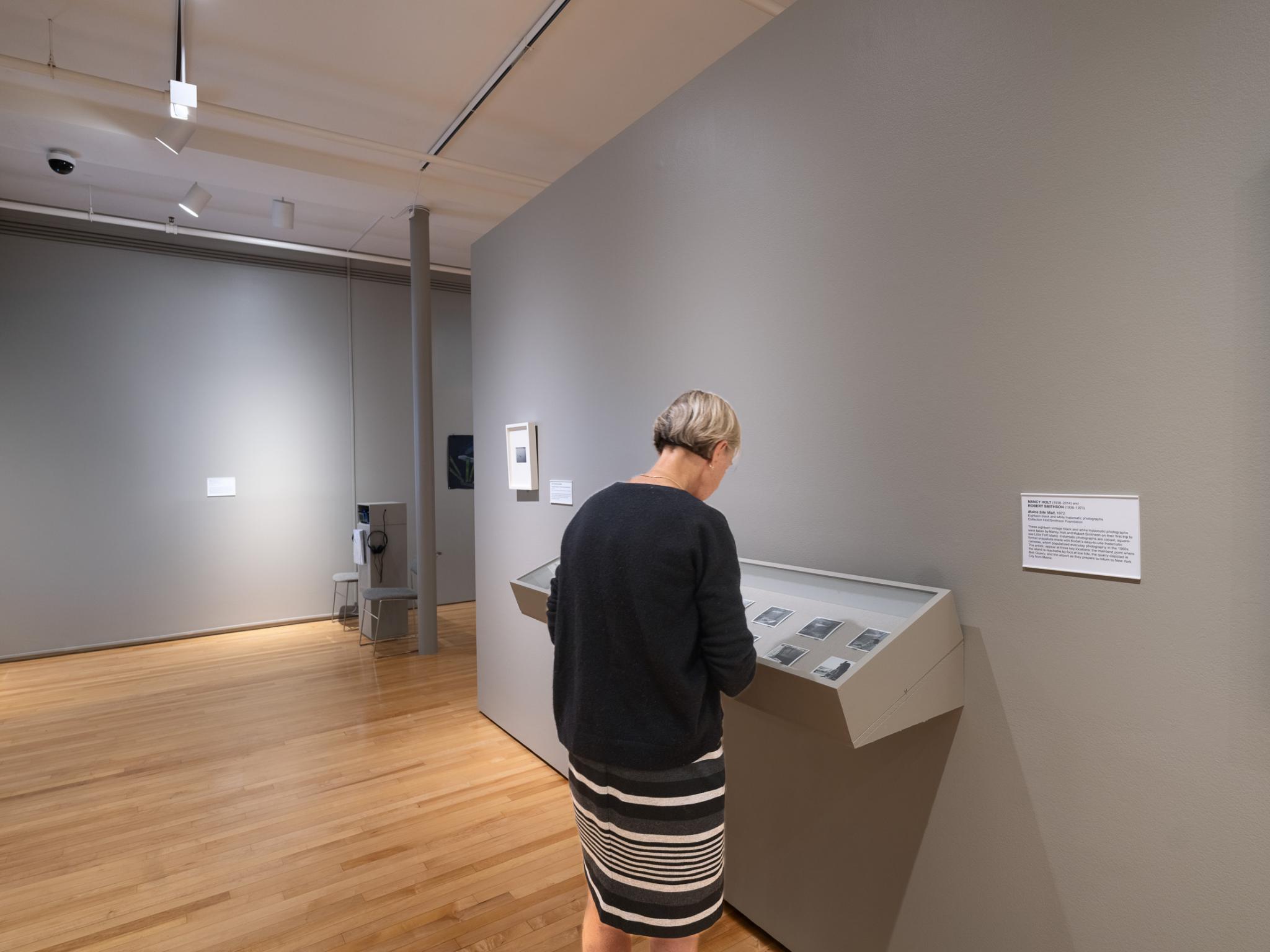 a visitor looking at an artwork