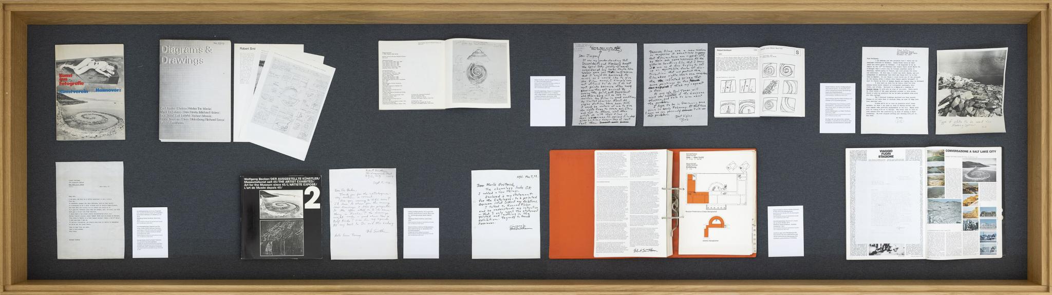a showcase holding letters and papers