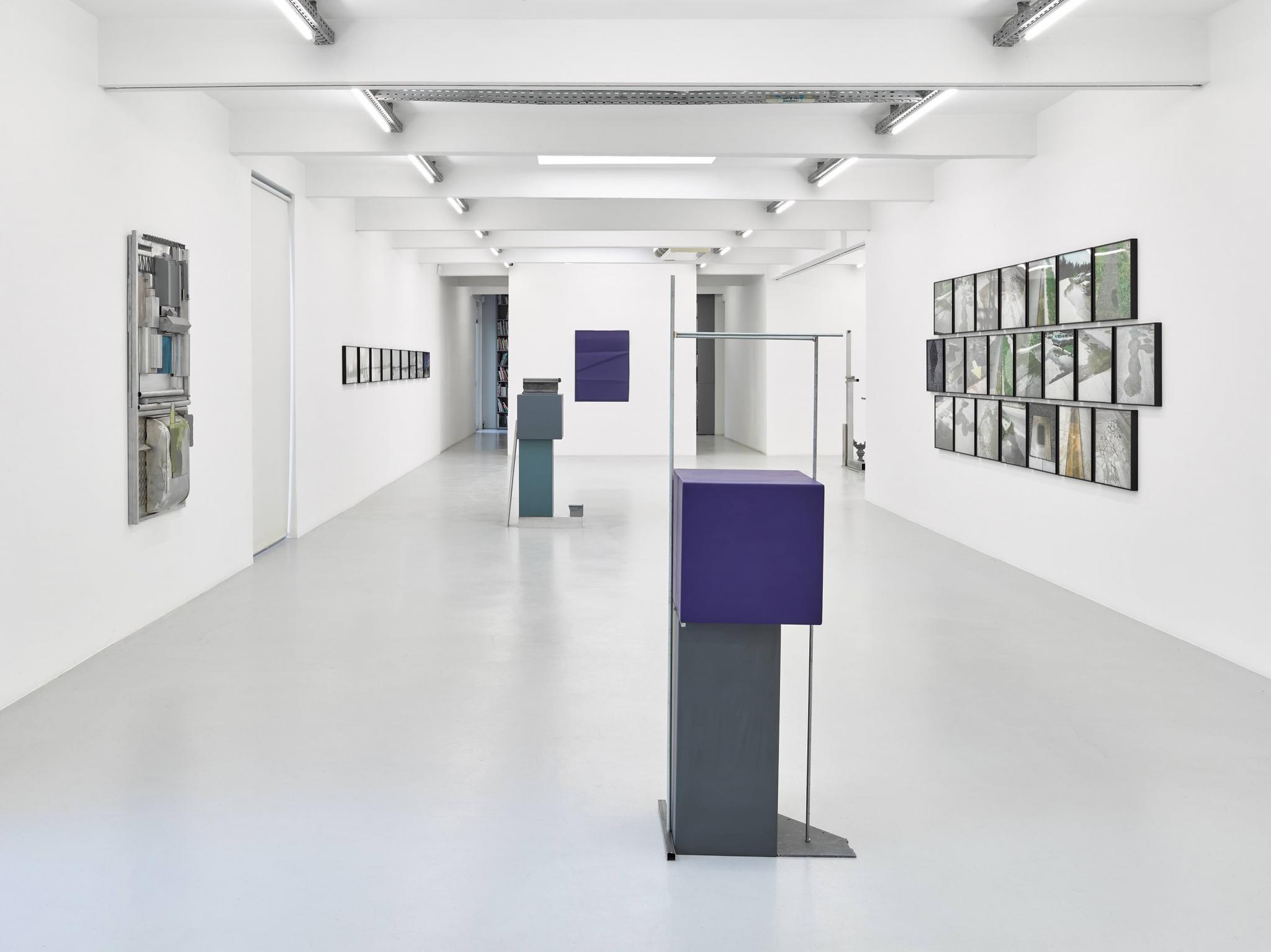 an exhibition in a white walled gallery