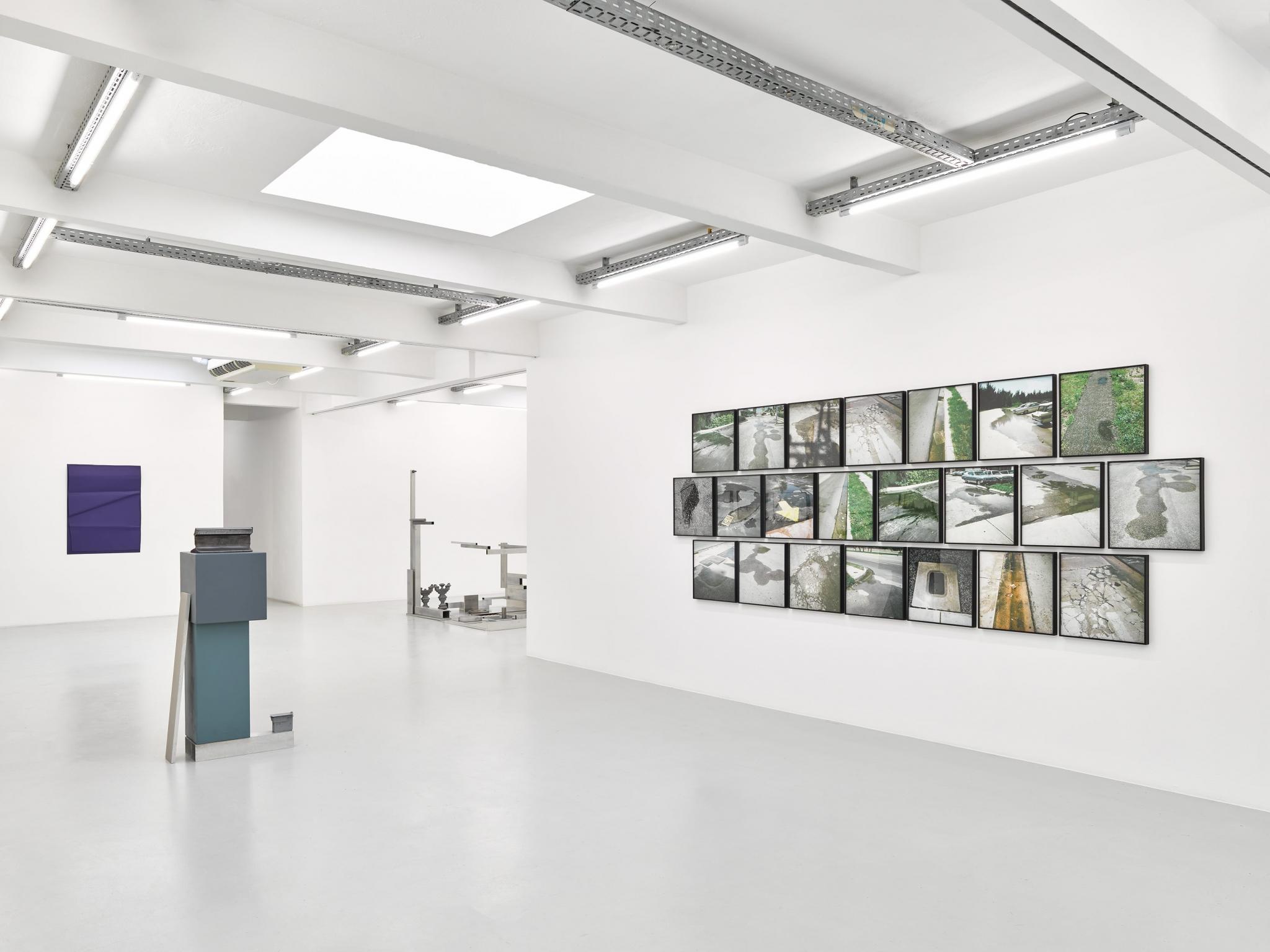 an exhibition in a white walled gallery