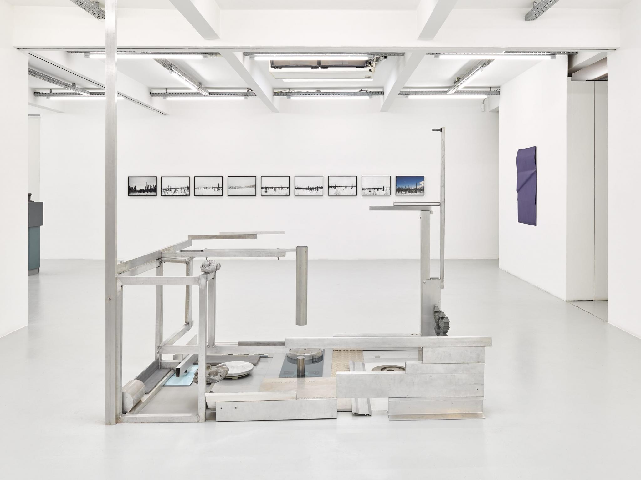 an exhibition in a white walled gallery
