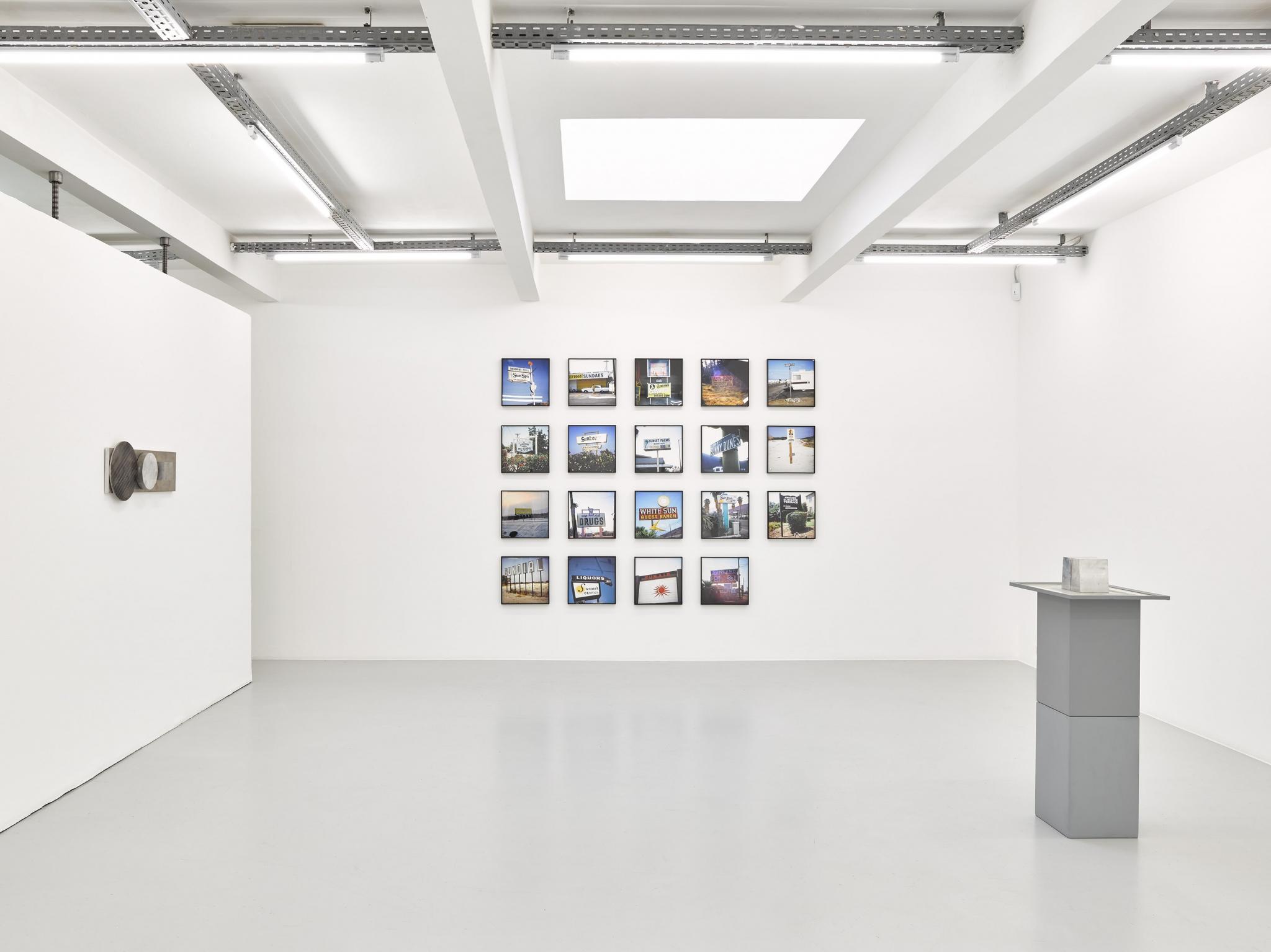 an exhibition in a white walled gallery