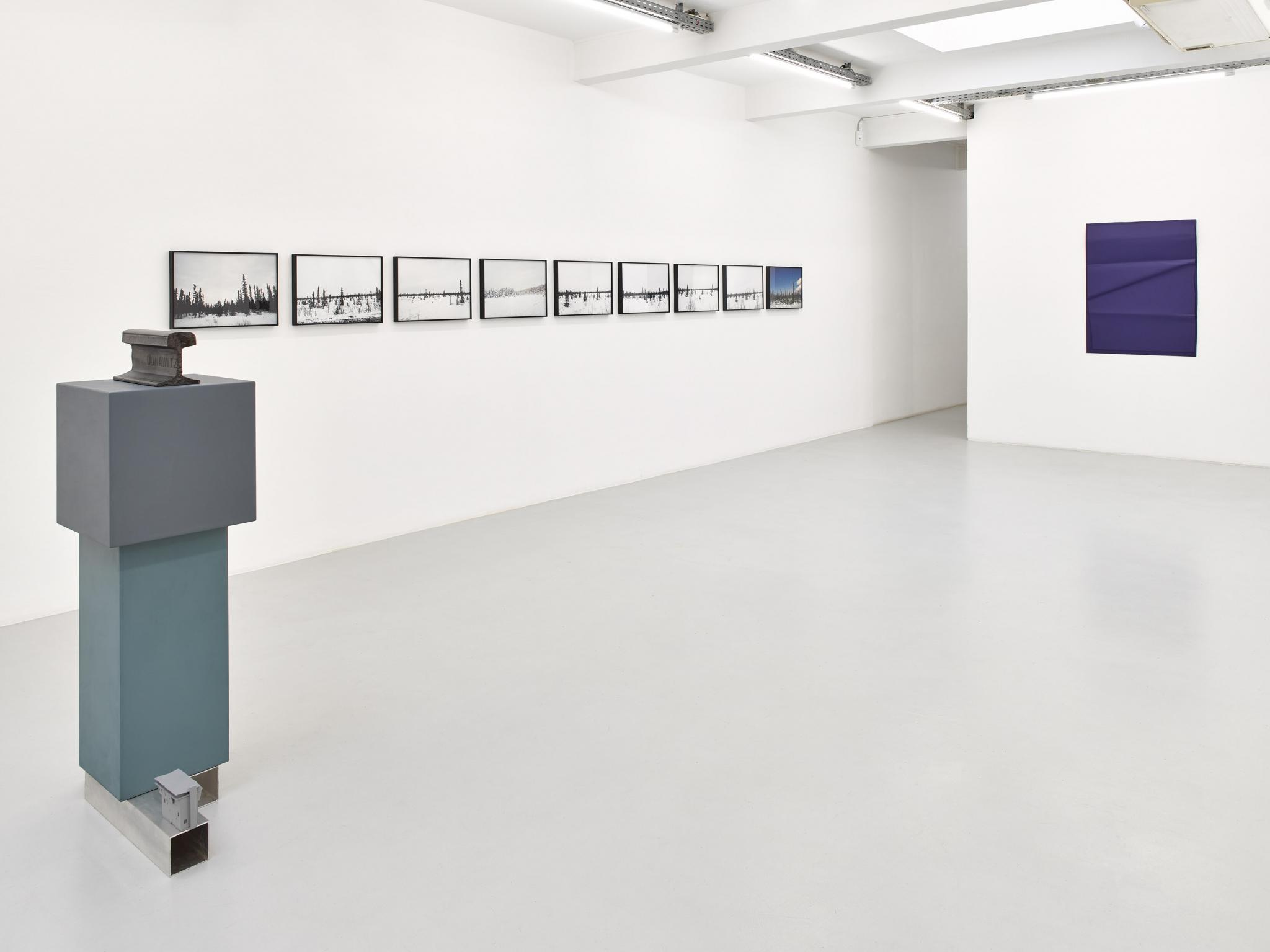 an exhibition in a white walled gallery