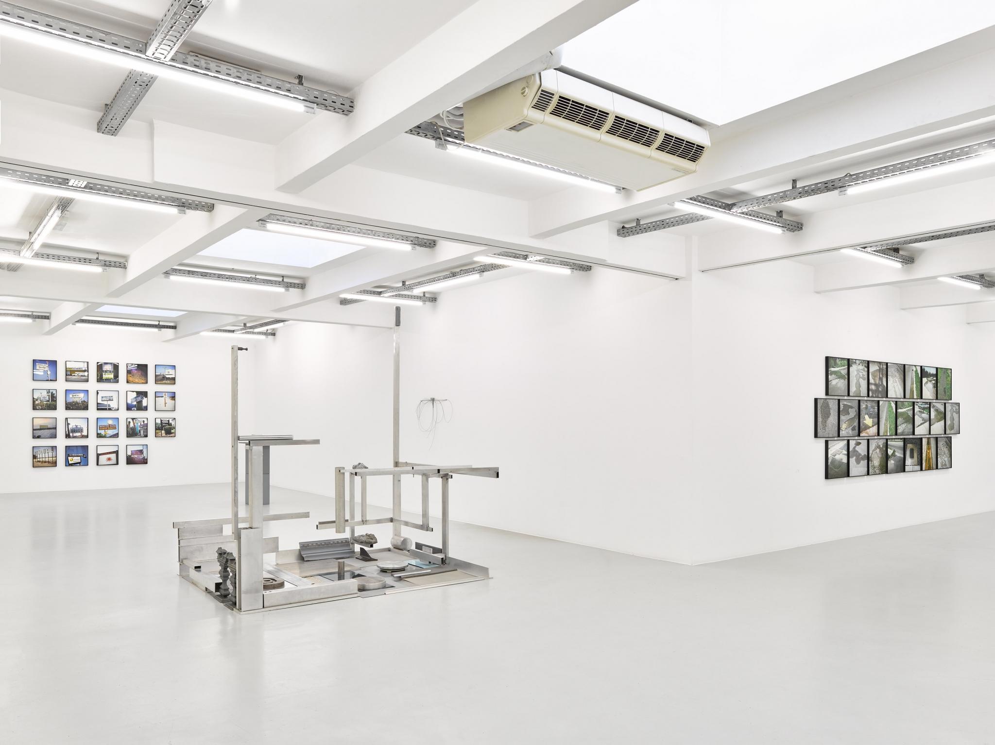 an exhibition in a white walled gallery