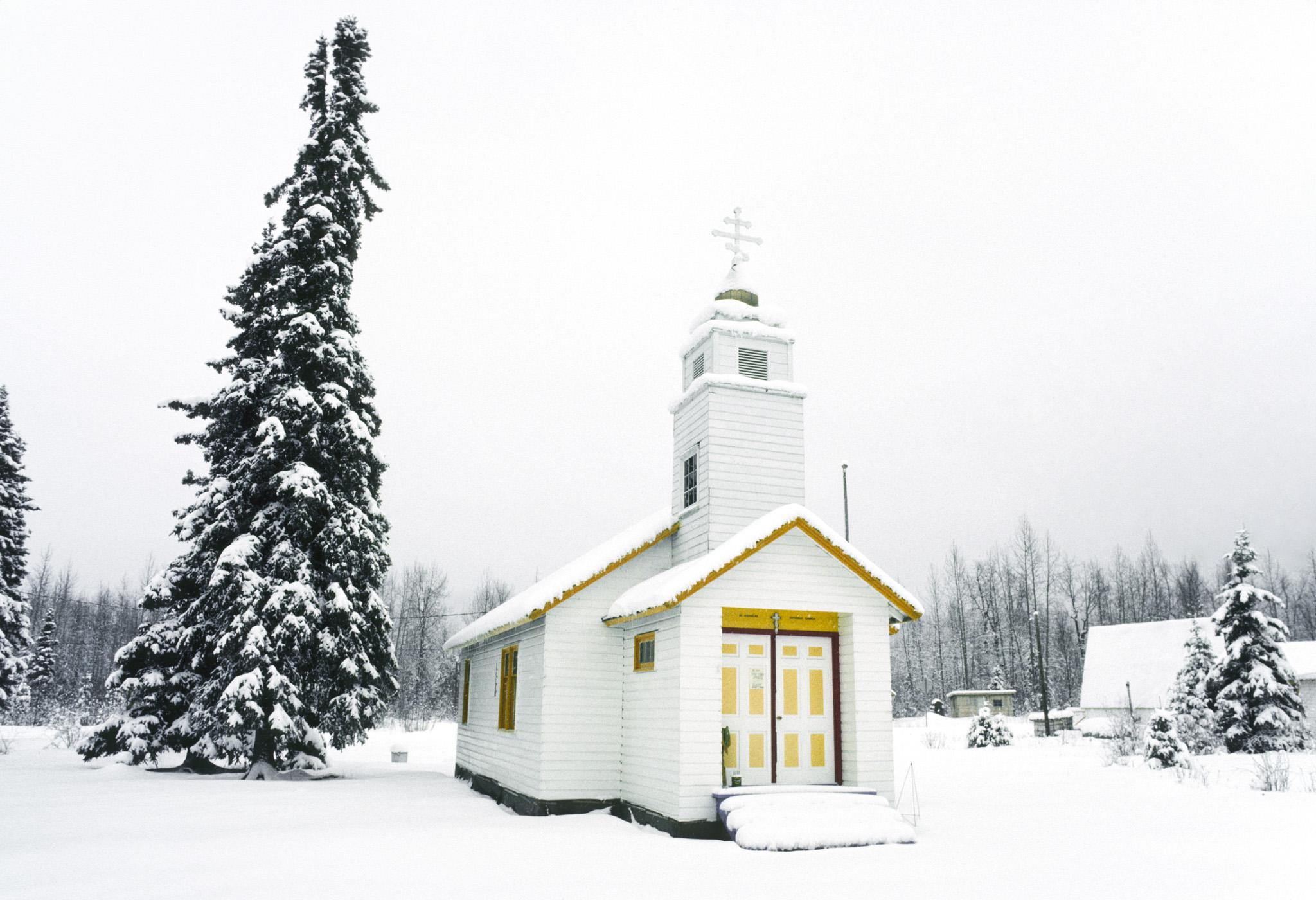 a small church in the snow