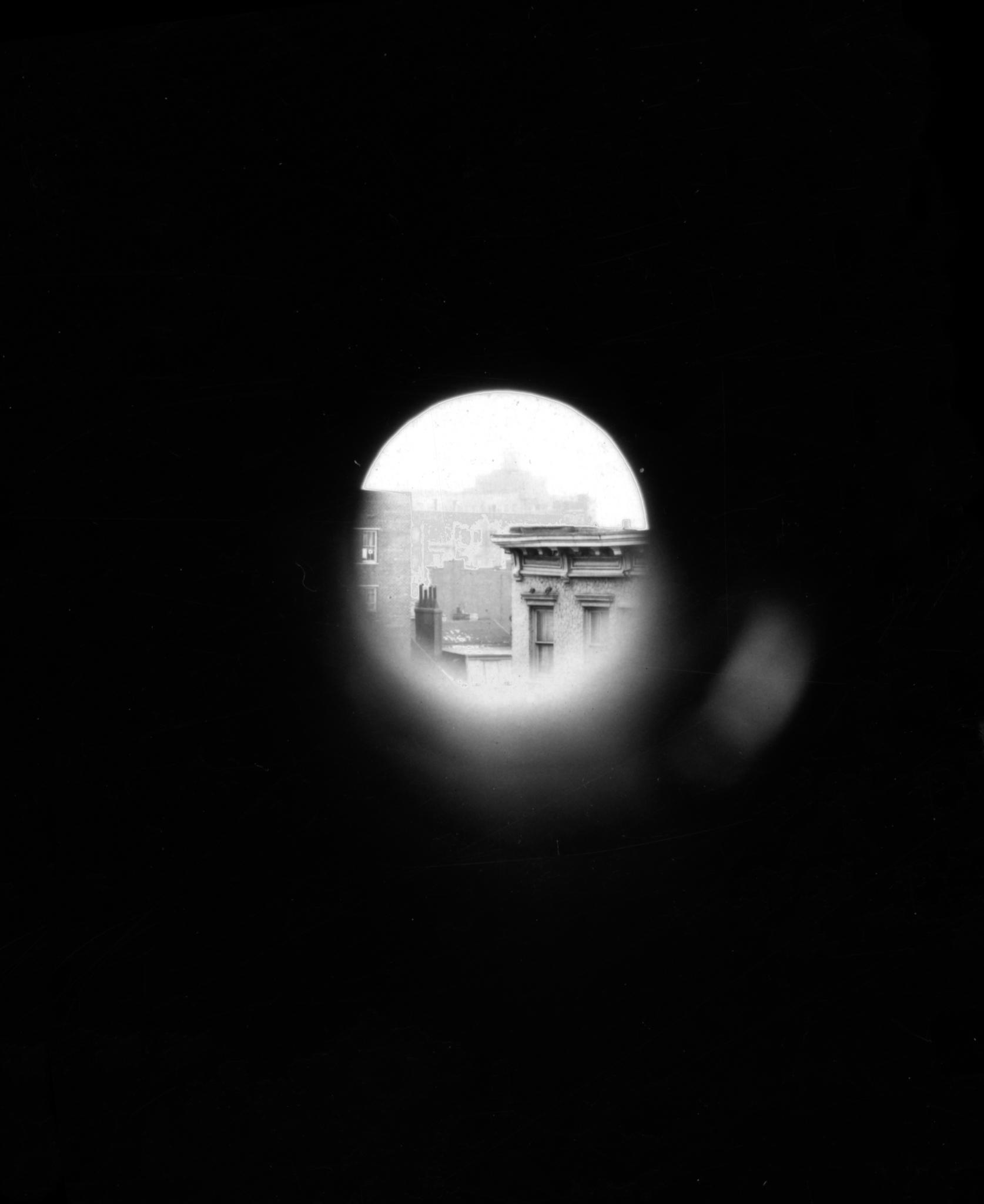 a circular view of a city surrounded by black