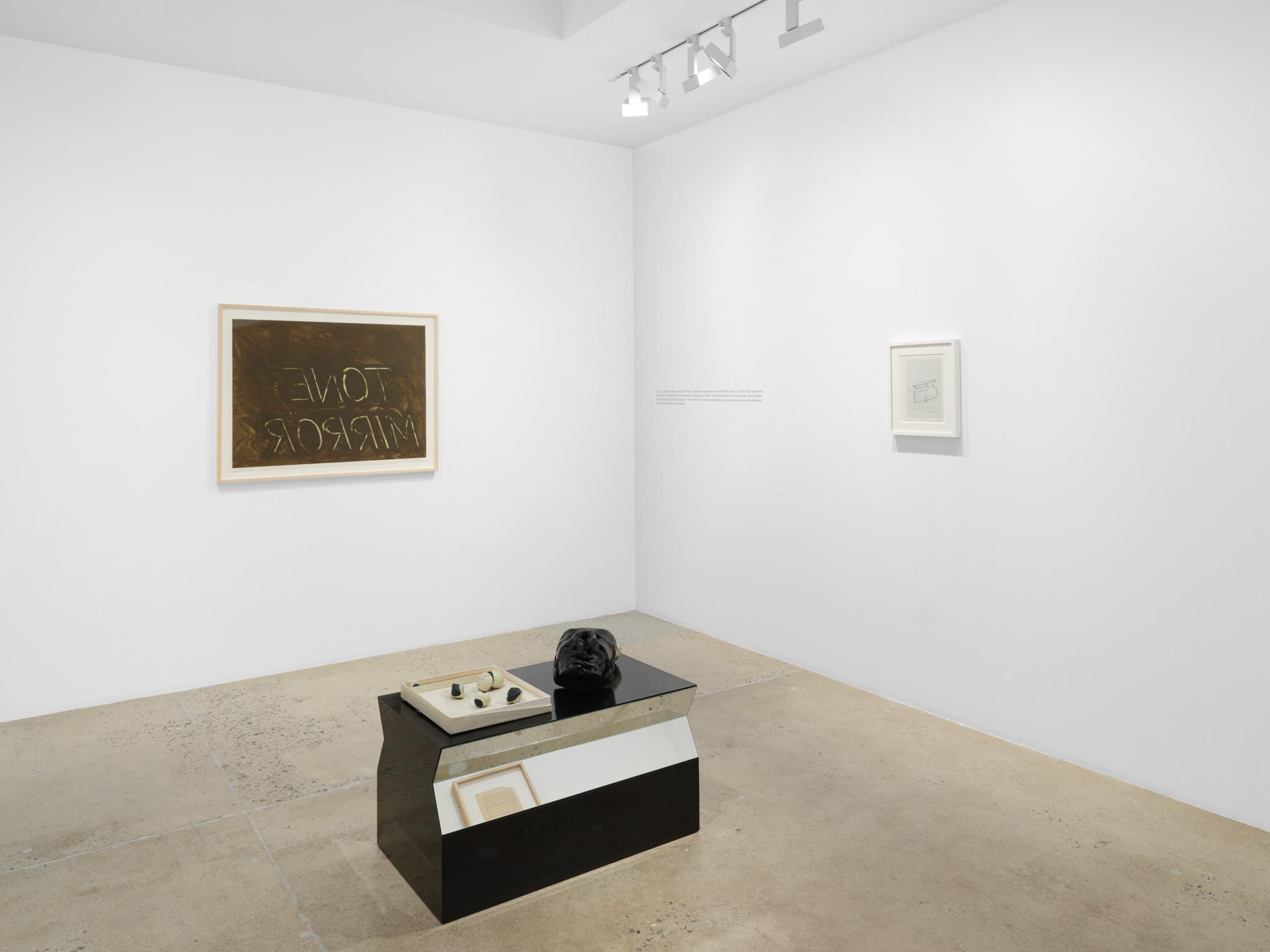 Installation view: Casting a Glance: Dancing with Smithson, Marian Goodman Gallery, Los Angeles, CA, 2025 featuring a formica table with mirrors by Robert Smithson and sculptures by Gabriel Orozco