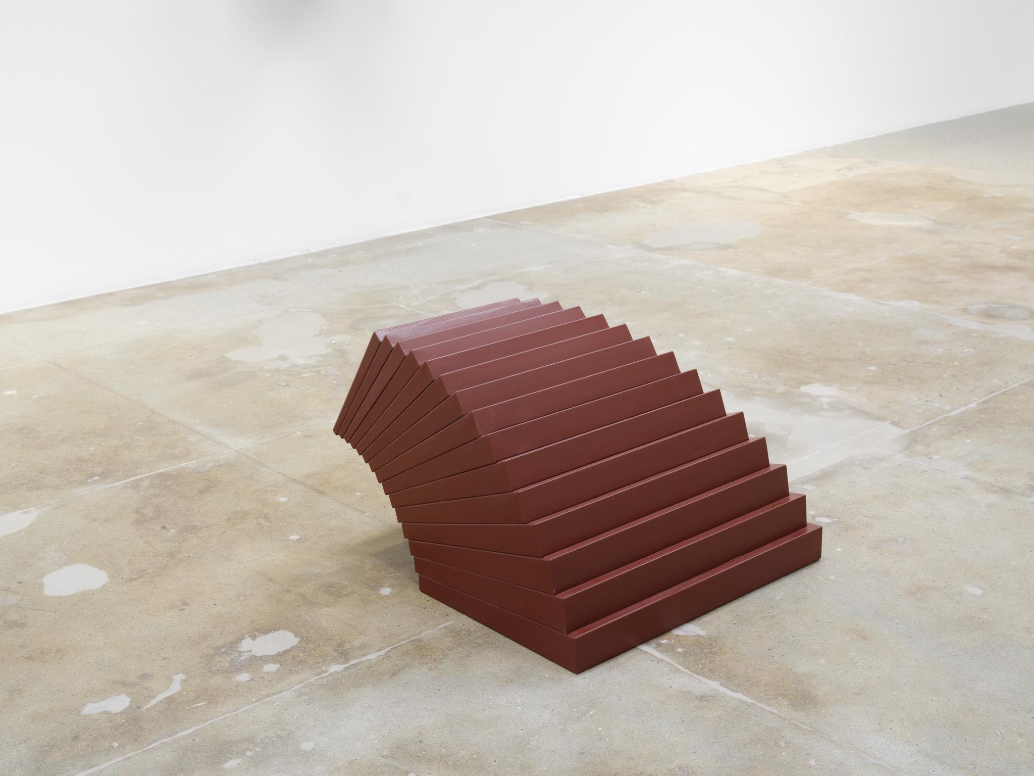 Installation view: Casting a Glance: Dancing with Smithson, Marian Goodman Gallery, Los Angeles, CA, 2025 featuring a red metal sculpture resembling curved steps