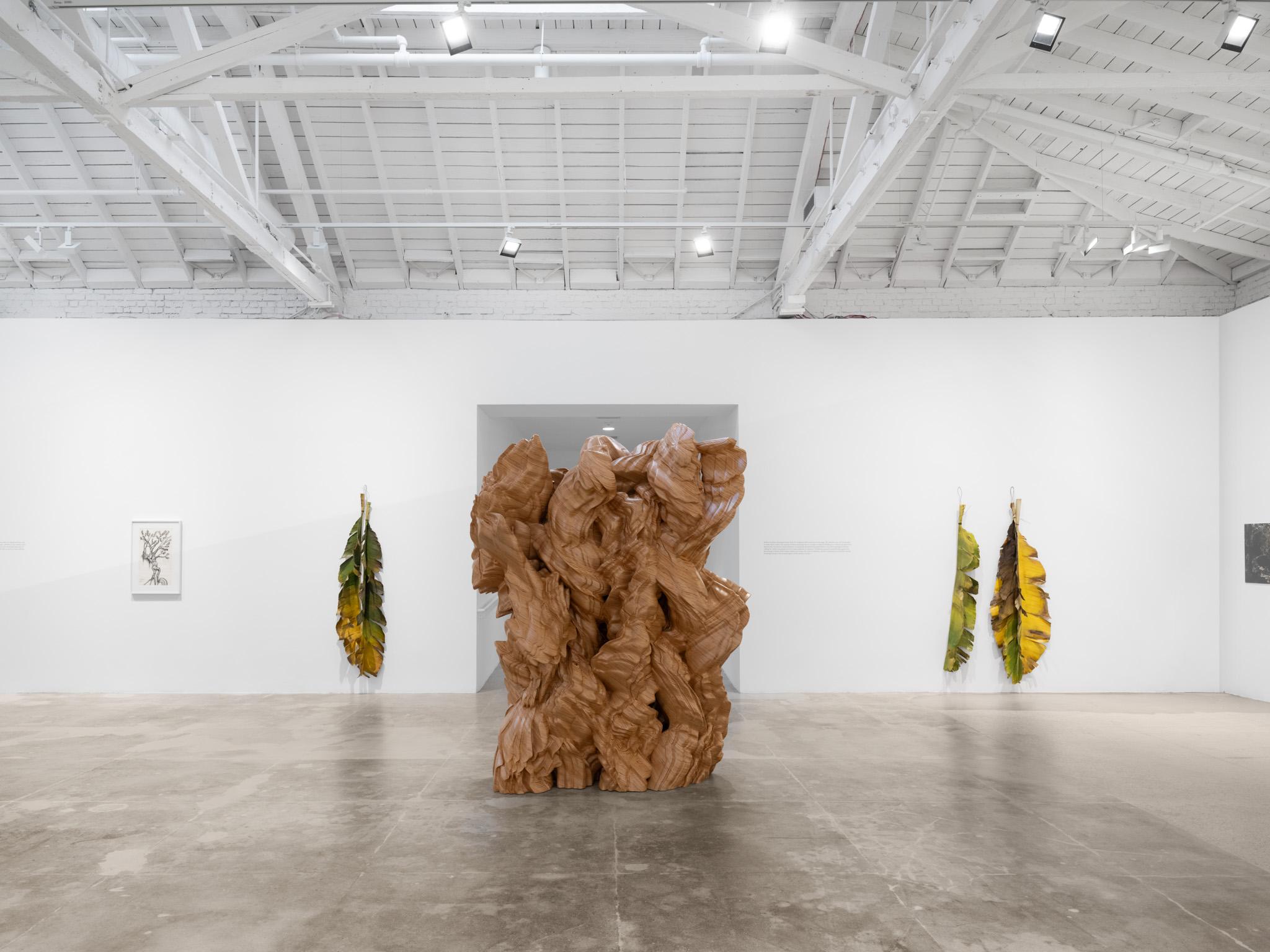 Installation view: Casting a Glance: Dancing with Smithson, Marian Goodman Gallery, Los Angeles, CA, 2025 Tony Cragg sculpture displayed in middle ground