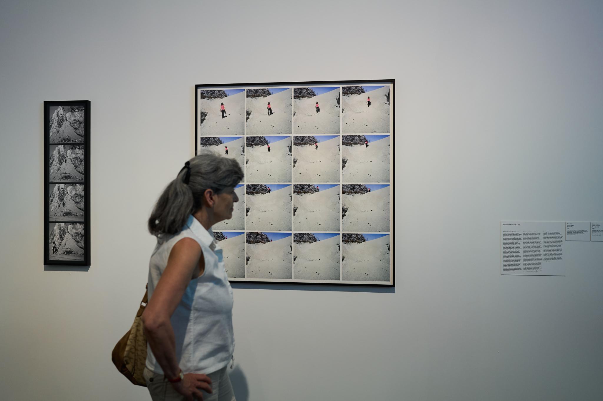 a woman looking at art in the museum