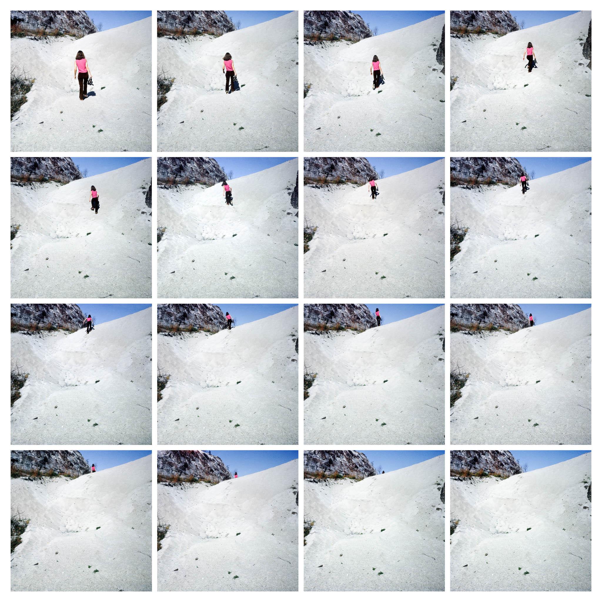 images of a woman walking up a sand dune