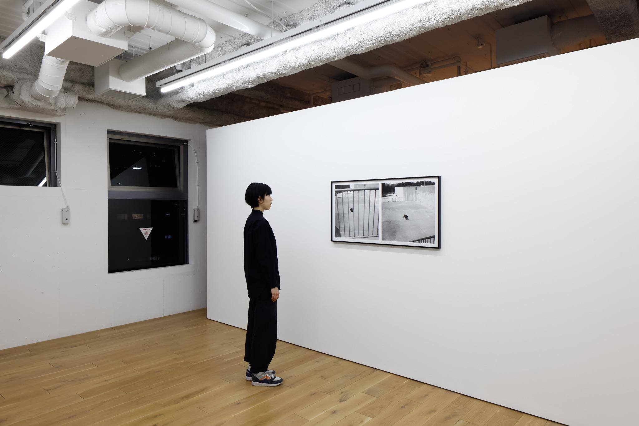 a person looking at an artwork