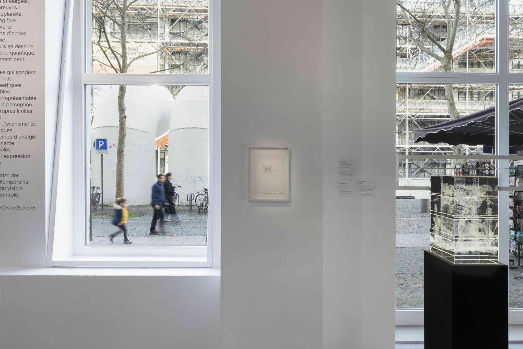 installation view of an art exhibition, looking out to the street