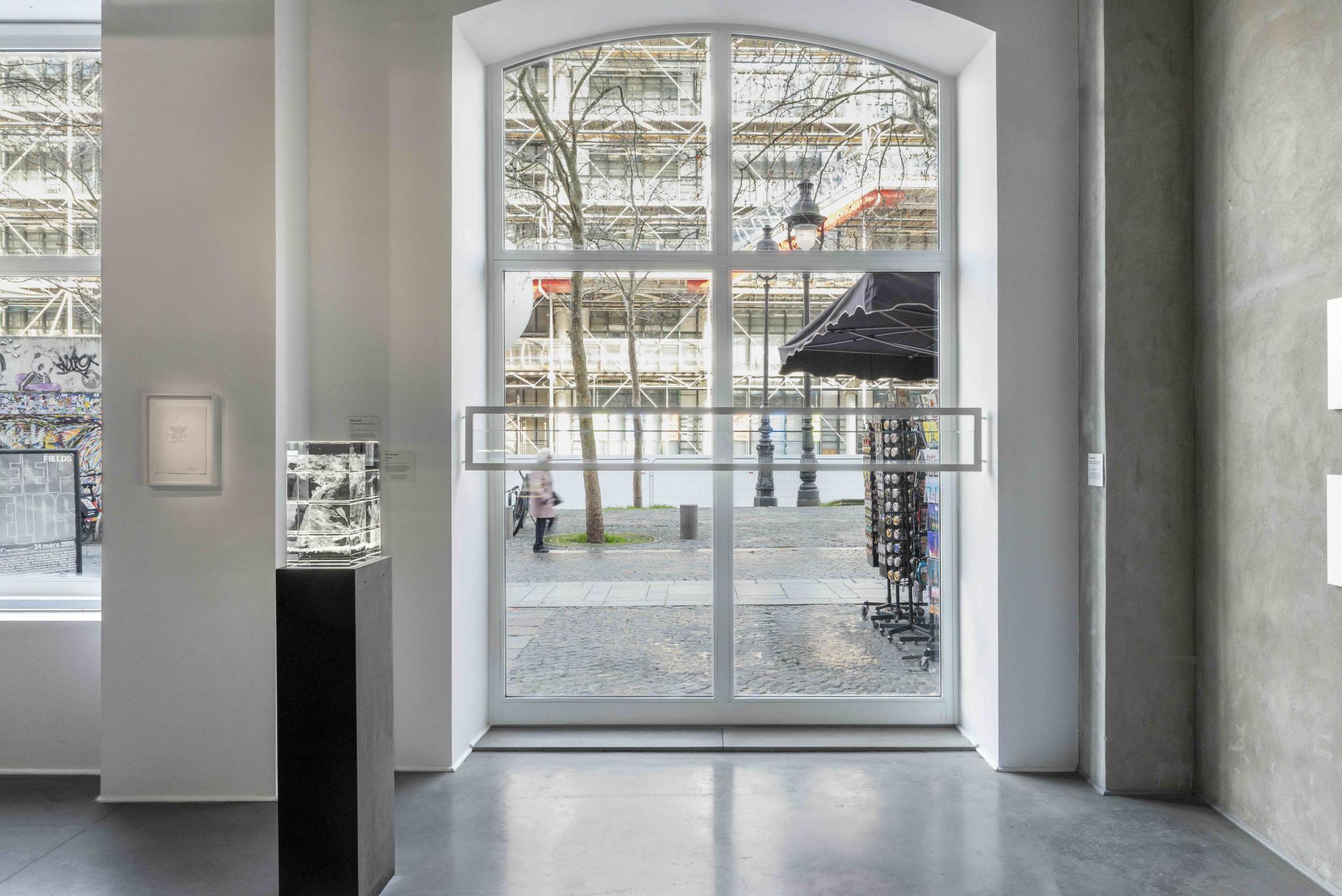 installation view of an artwork comprising typewriter text within a circle