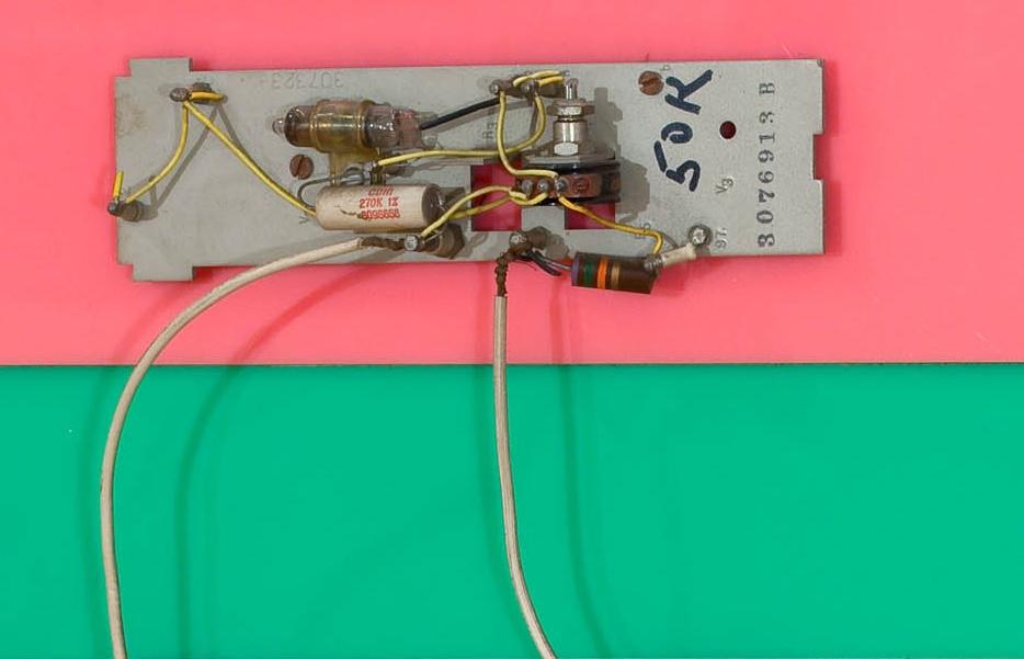 wall based sculpture with an eye at the center