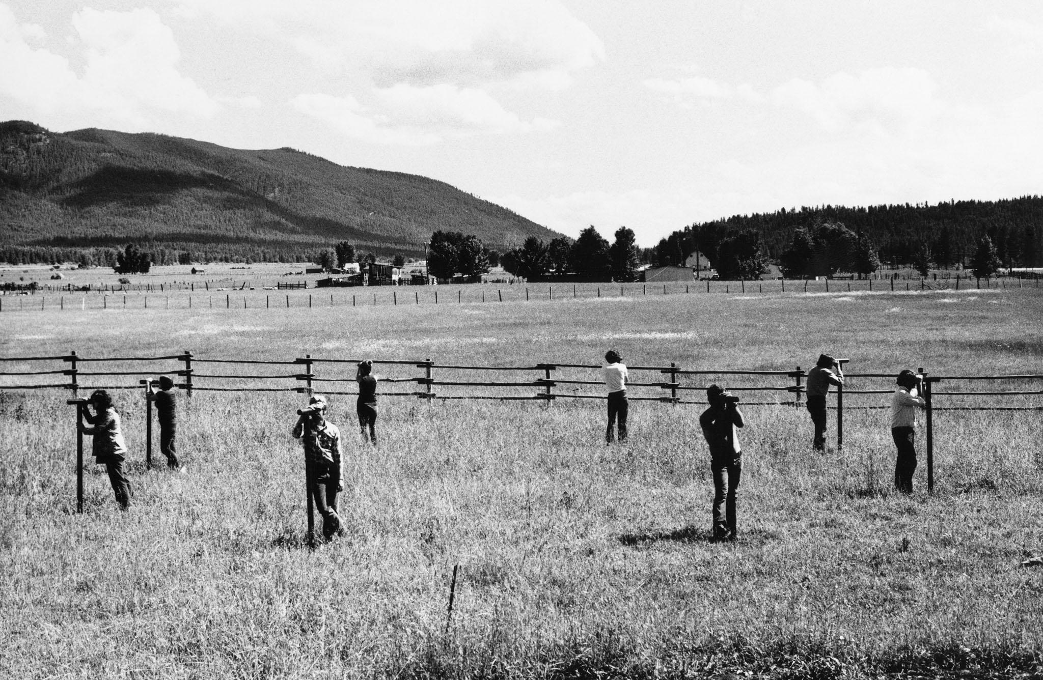 people looking through a circle of Locators