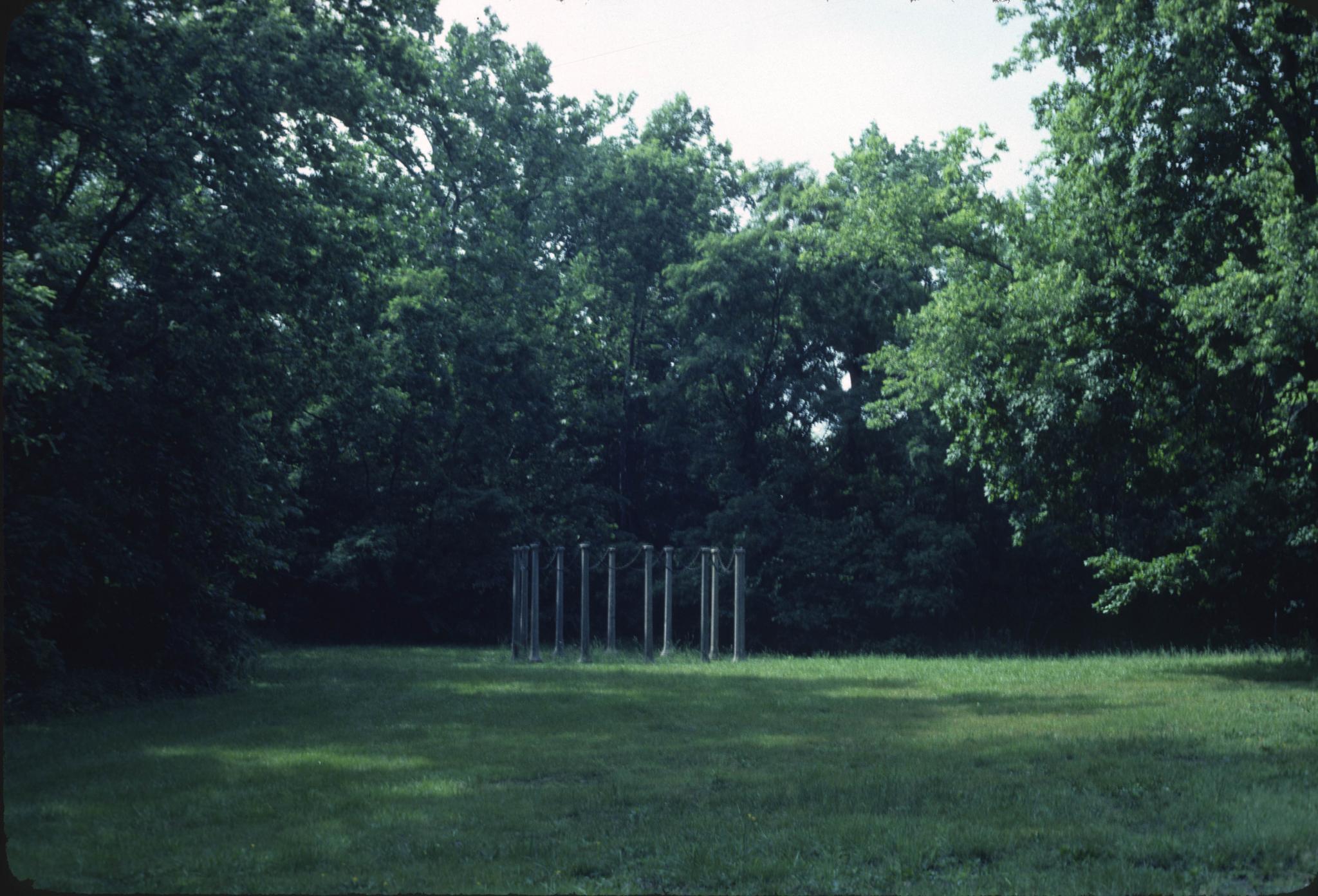a sculpture comprising a circle of stone posts