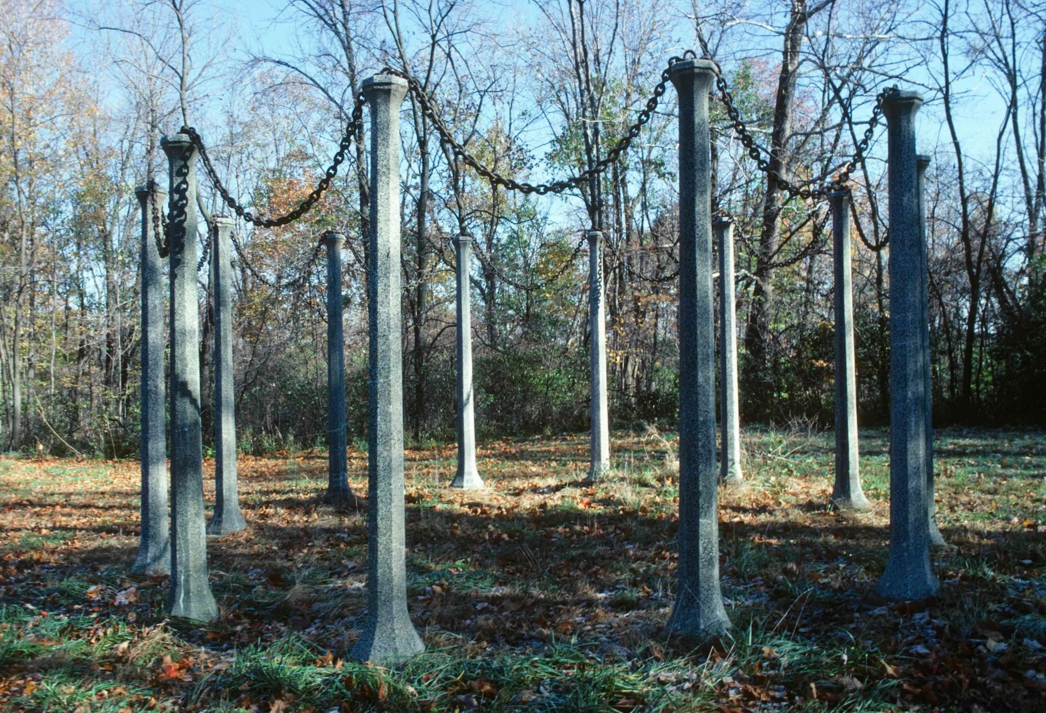 a sculpture comprising a circle of stone posts