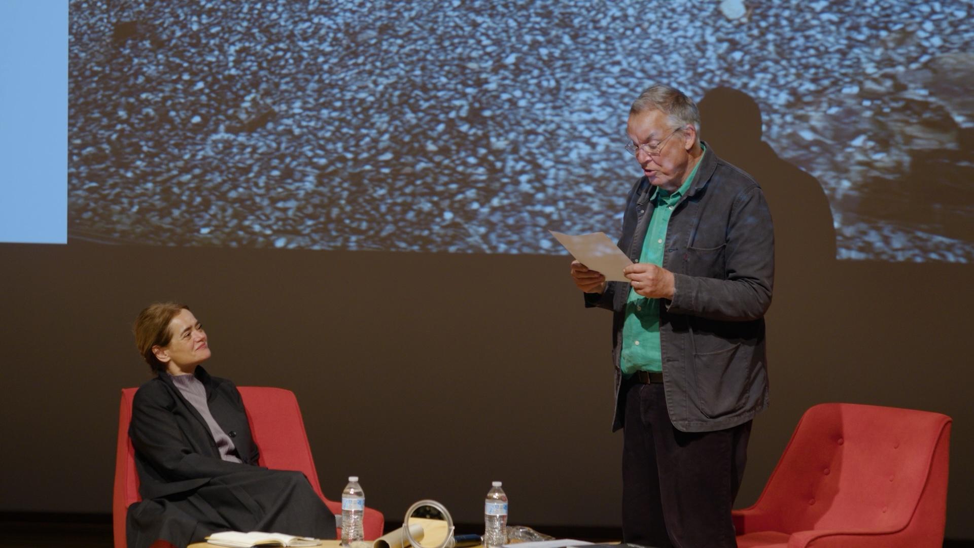 two people talking on stage