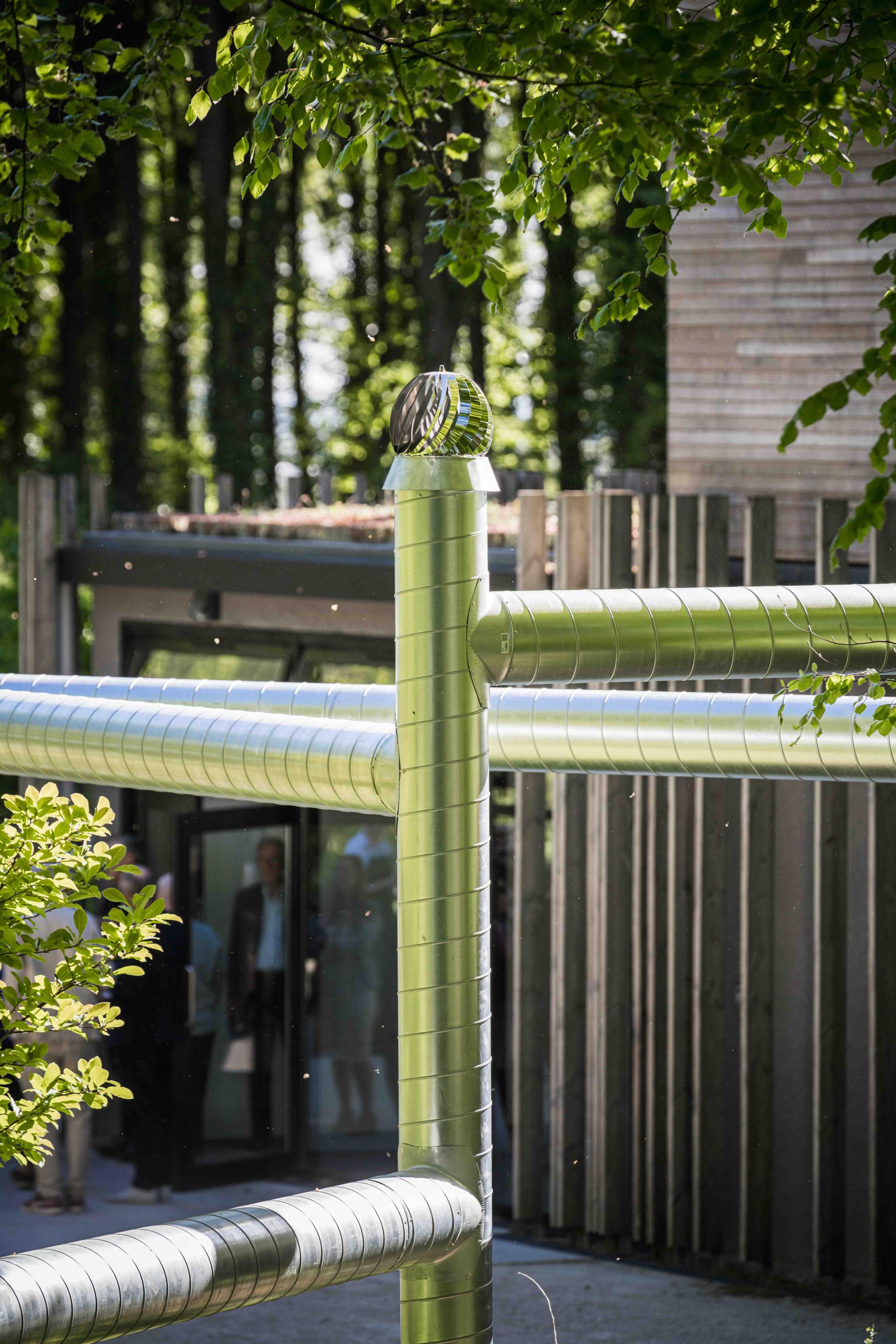 a detail of a sculpture made from ventilation pipes
