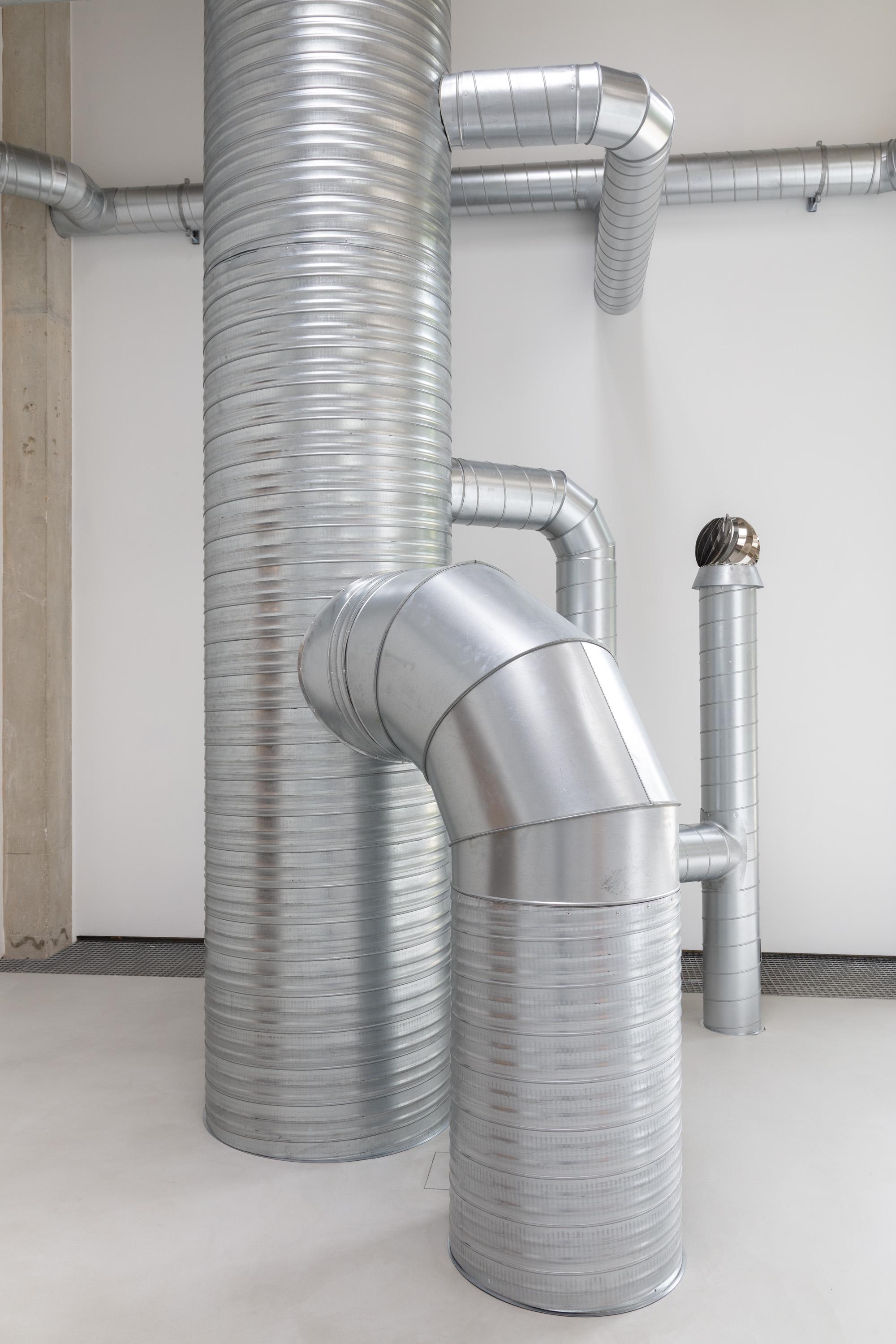 detail of an artwork made of ventilation pipes