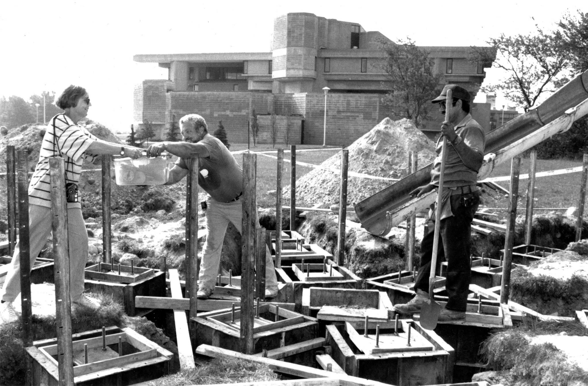 an outdoor sculpture in the form on an industrial device being installed