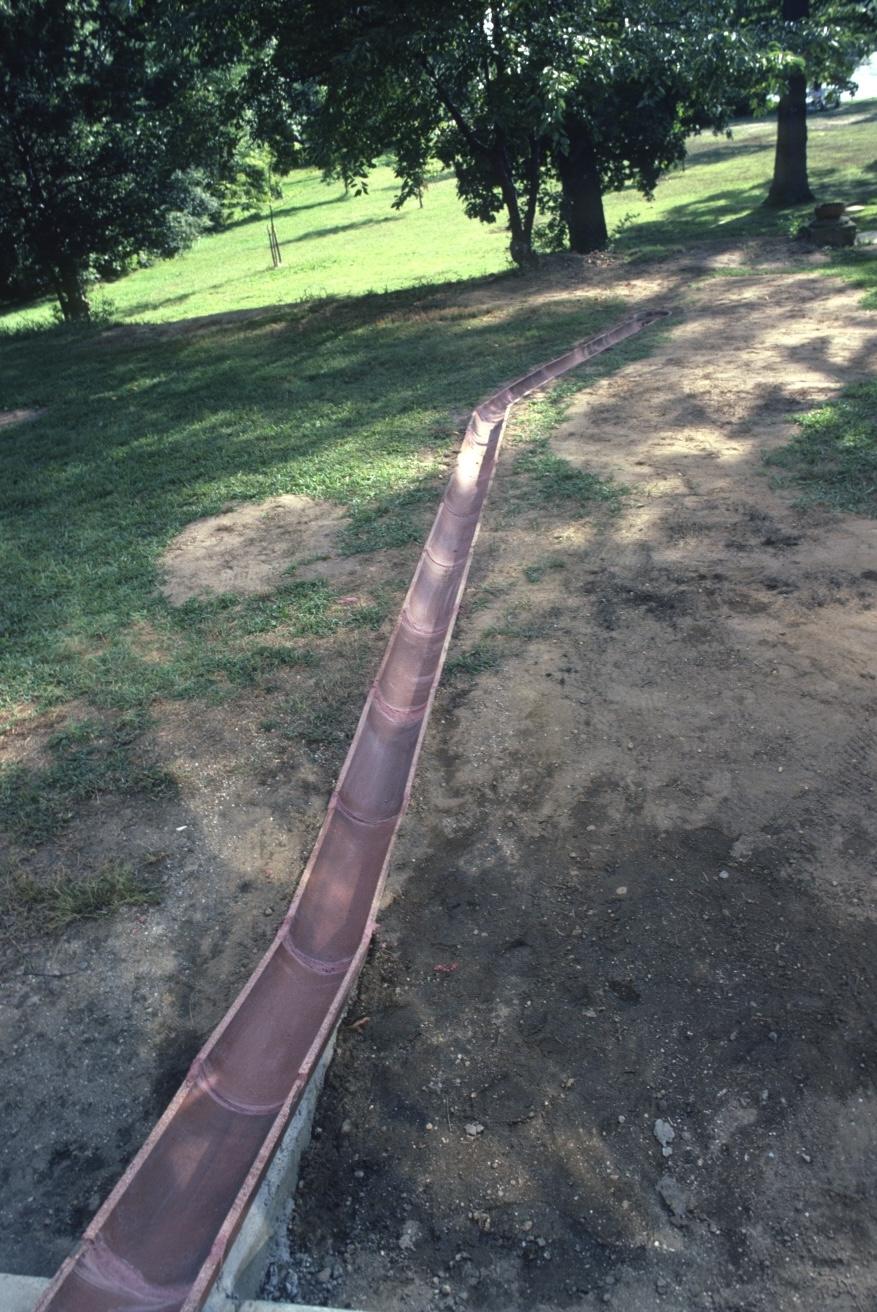 a sculpture made out of a drainage system