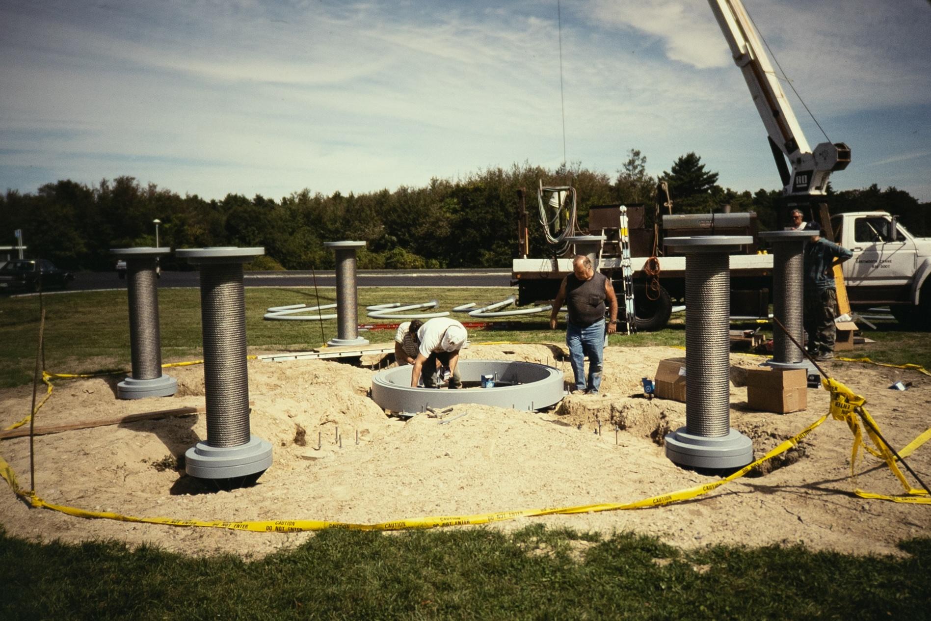 an outdoor sculpture being installed