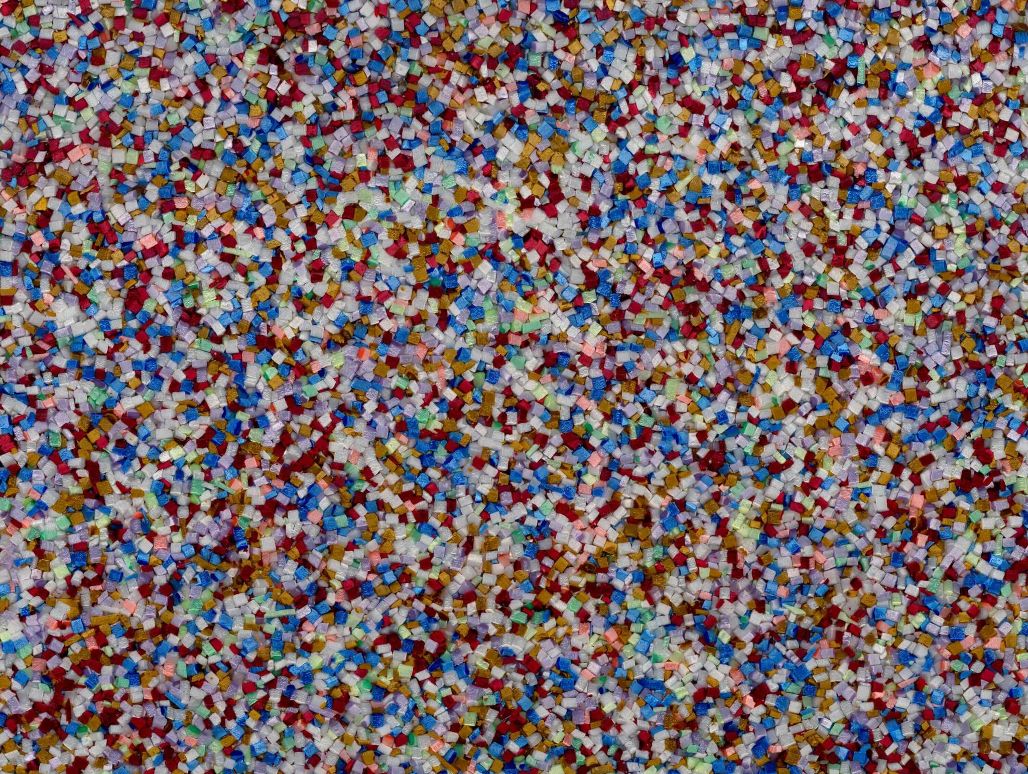 detail of a sculpture showing brightly colored Plexiglas fragments